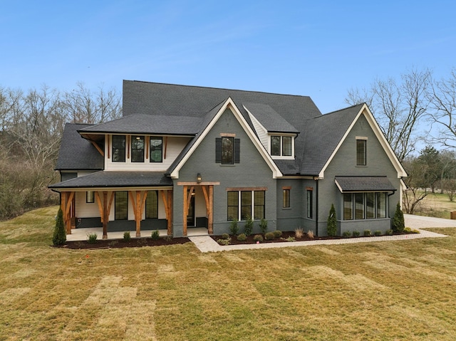 view of front of house with a patio area and a front yard