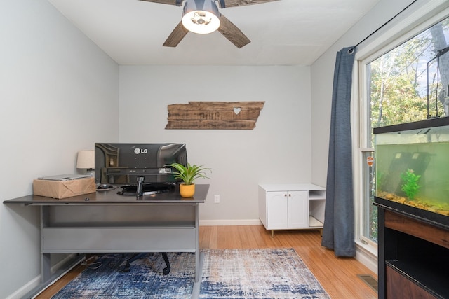 office area with ceiling fan and light hardwood / wood-style flooring