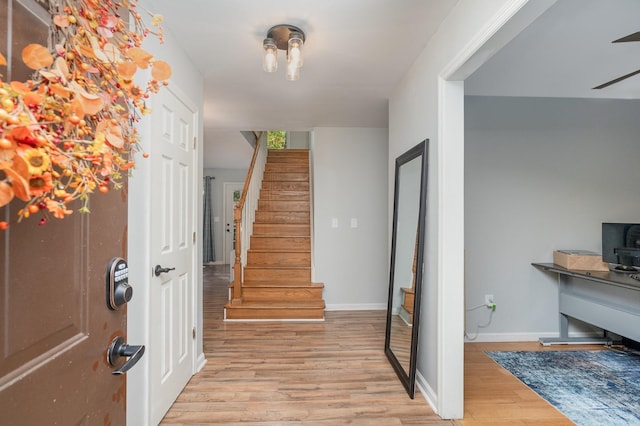 entryway with light hardwood / wood-style floors