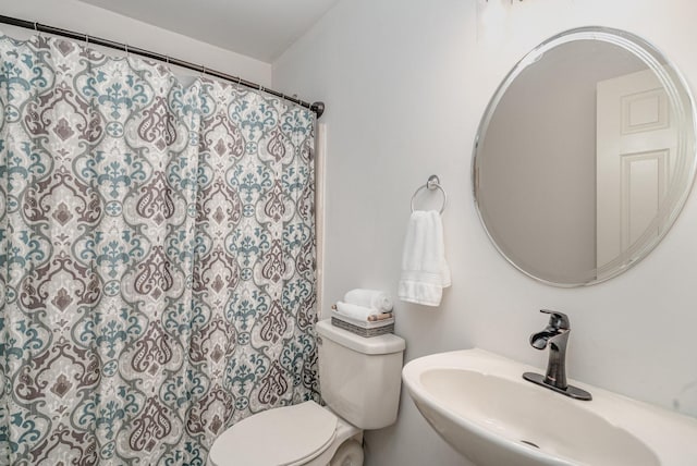 bathroom featuring toilet and sink