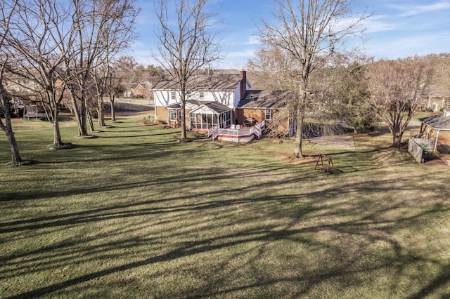 view of yard featuring a sunroom