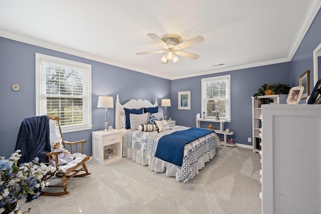 carpeted bedroom with crown molding and ceiling fan