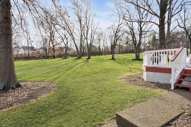 view of yard with a wooden deck