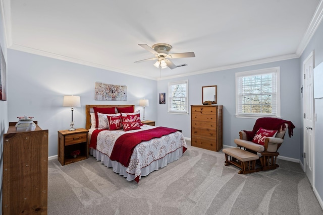 carpeted bedroom with ornamental molding and ceiling fan