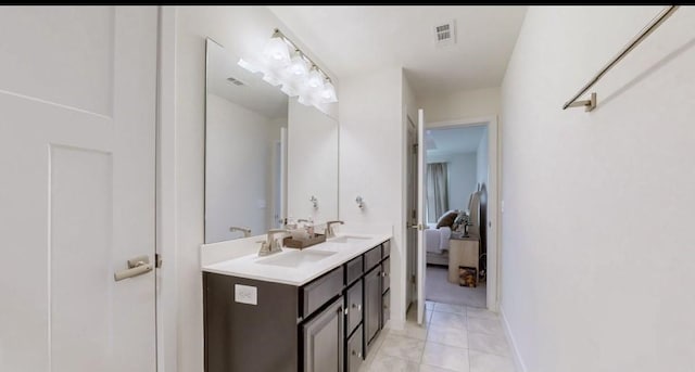 bathroom with tile patterned floors and vanity