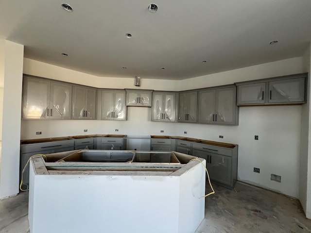 kitchen with gray cabinets and a center island