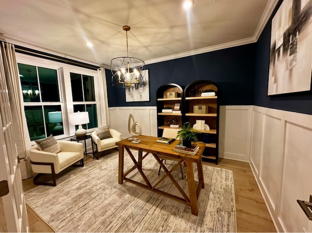 office area with hardwood / wood-style flooring, crown molding, and a notable chandelier