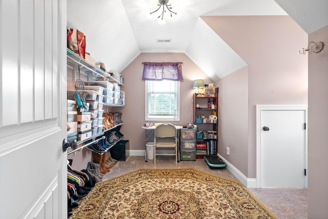 office area featuring lofted ceiling and carpet