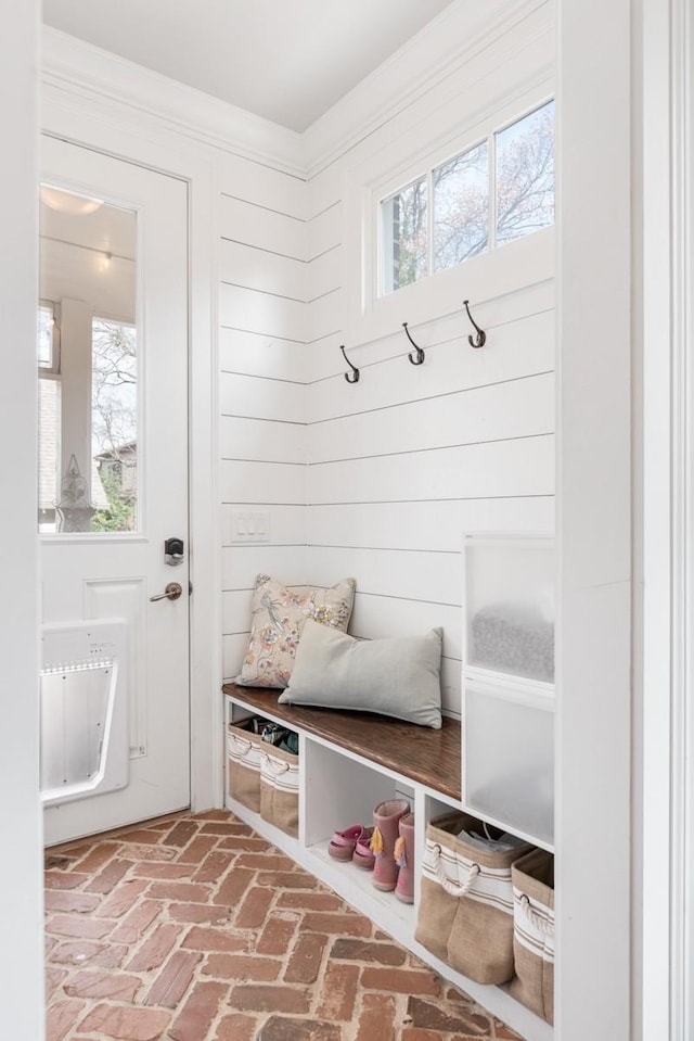 mudroom featuring ornamental molding