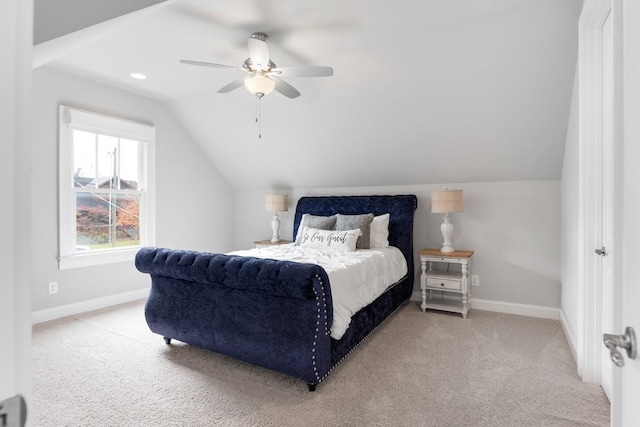 carpeted bedroom featuring vaulted ceiling and ceiling fan