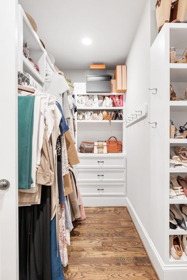 spacious closet featuring hardwood / wood-style flooring