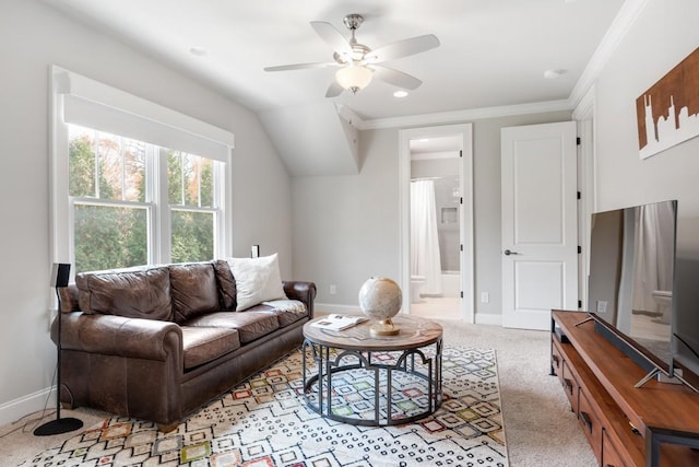 living room with crown molding, light colored carpet, ceiling fan, and vaulted ceiling