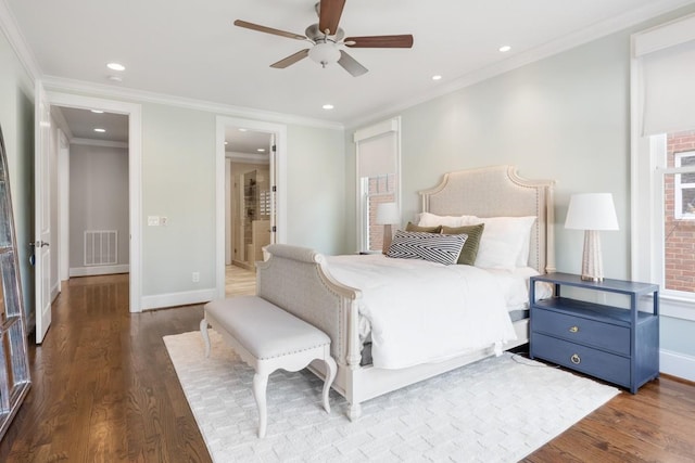 bedroom featuring wood-type flooring, connected bathroom, ceiling fan, and crown molding