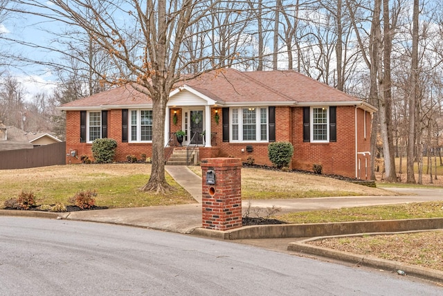 single story home with a front yard