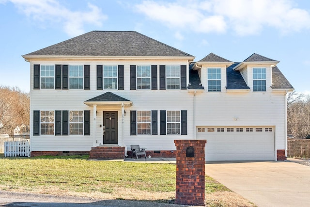 view of front facade with a front yard, crawl space, an attached garage, and concrete driveway