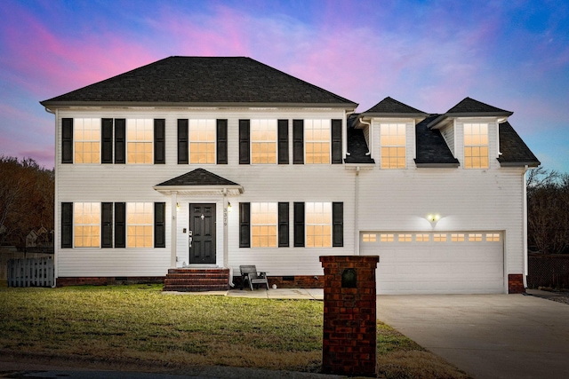 colonial house with entry steps, crawl space, a lawn, and driveway