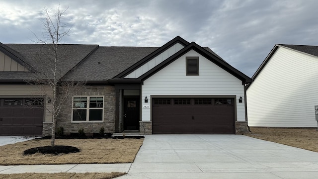 2836 Soldiers Honor Dr, Murfreesboro, TN 37128 - view of front facade with board and batten siding, stone siding, driveway, and a shingled roof