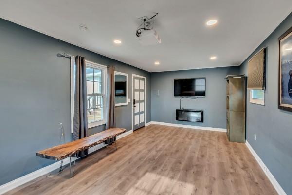 unfurnished living room featuring light hardwood / wood-style flooring