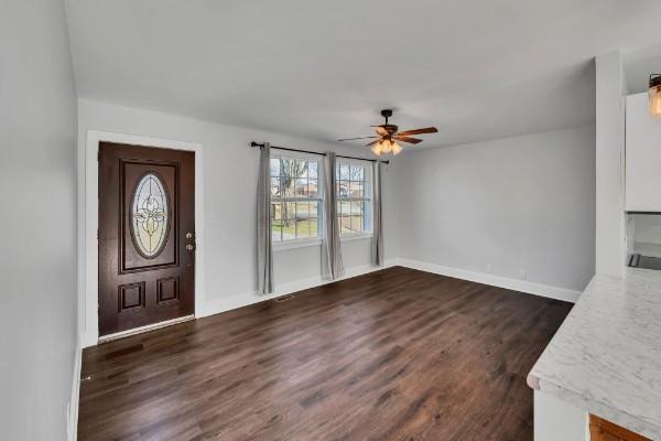 foyer entrance featuring ceiling fan and dark hardwood / wood-style flooring