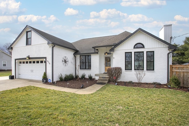 view of front of property with a garage and a front yard