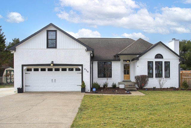 view of front of house featuring a garage and a front lawn