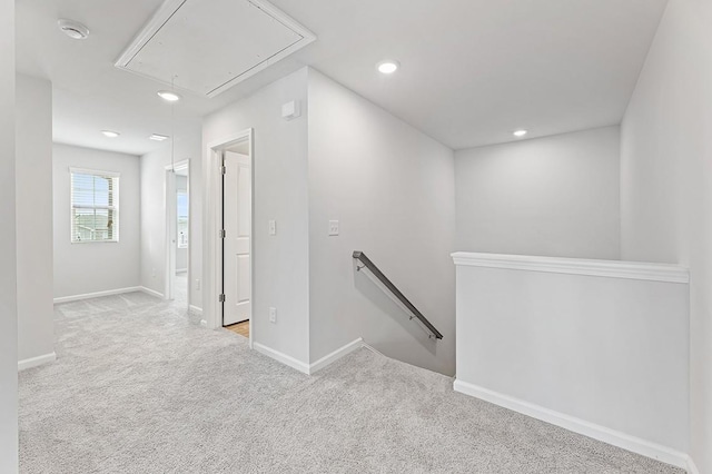 hallway featuring light carpet