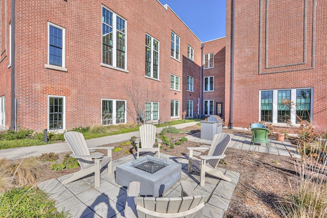 view of patio / terrace featuring an outdoor fire pit