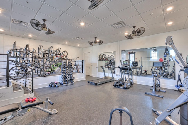 exercise room with a drop ceiling