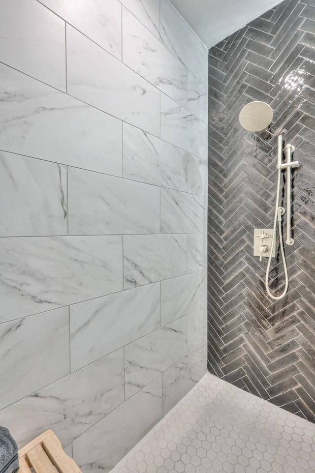 bathroom with tiled shower