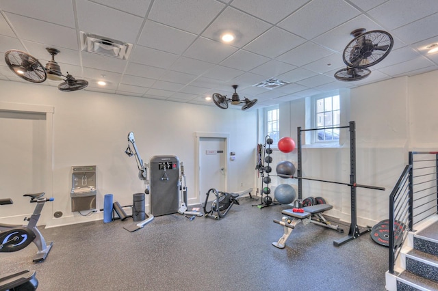 workout area with a paneled ceiling