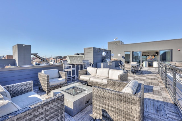 view of patio / terrace featuring a grill and an outdoor living space with a fire pit