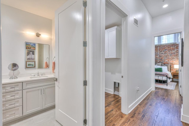 bathroom featuring vanity and hardwood / wood-style floors