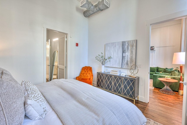 bedroom with hardwood / wood-style floors