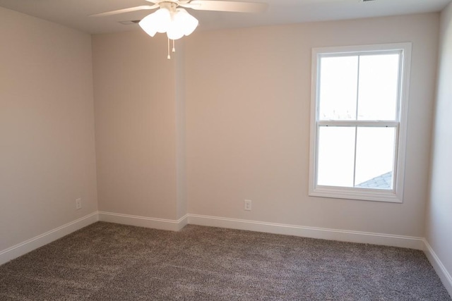 carpeted empty room featuring ceiling fan