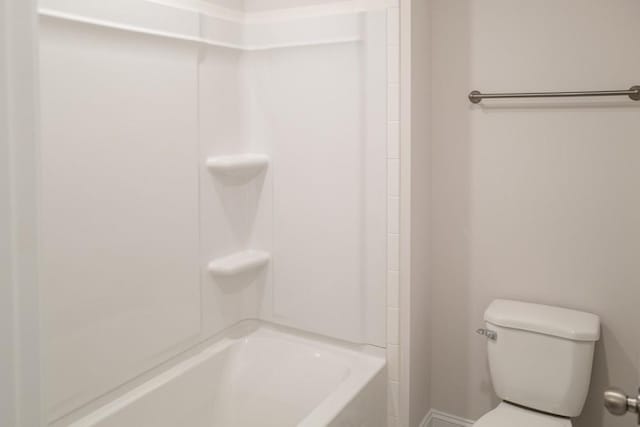 bathroom with toilet and shower / bath combination