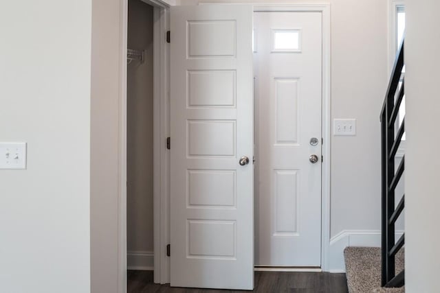 foyer with dark hardwood / wood-style flooring