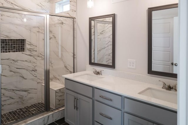 bathroom with vanity and a shower with shower door