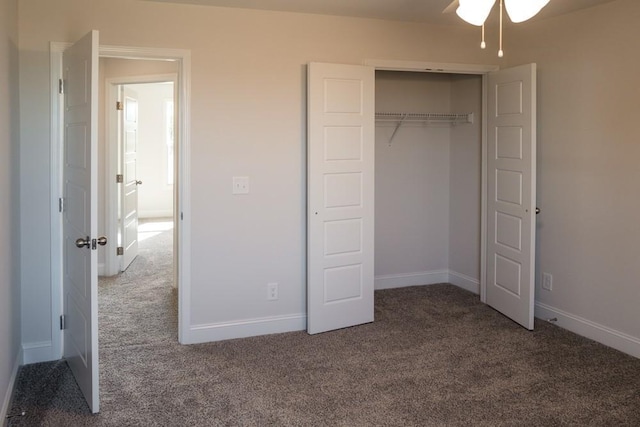 unfurnished bedroom featuring carpet flooring and a closet