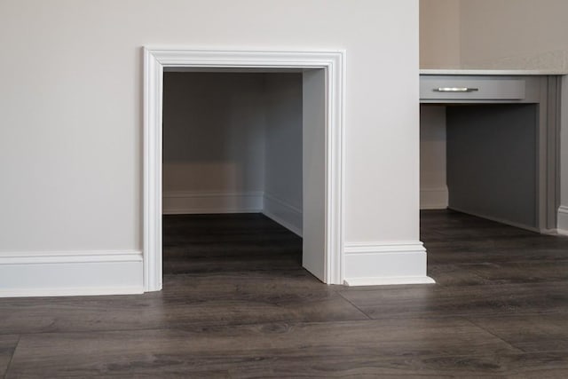 hall with dark hardwood / wood-style flooring