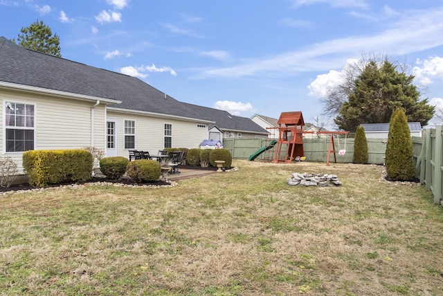 view of yard with a playground and a patio area