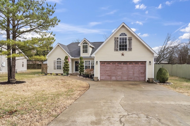 view of front of home featuring a garage and a front lawn