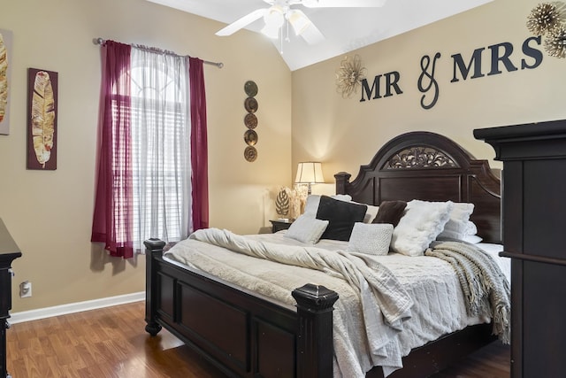 bedroom featuring wood-type flooring, vaulted ceiling, and ceiling fan