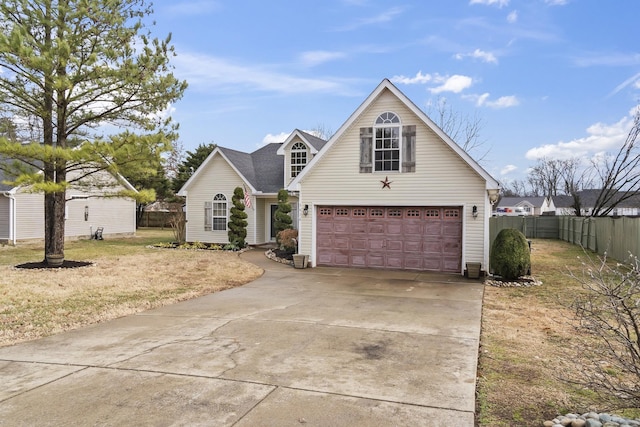 view of front property featuring a garage and a front yard