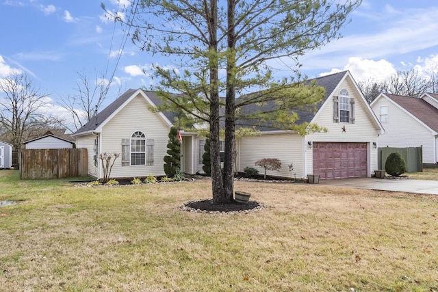 view of front of property featuring a garage and a front yard