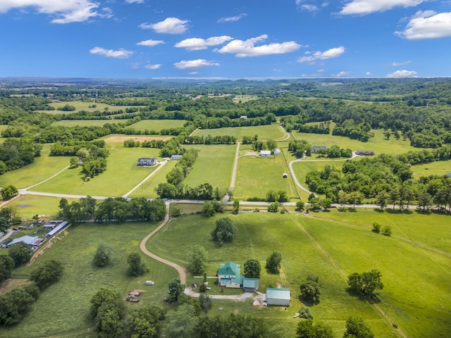 birds eye view of property with a rural view