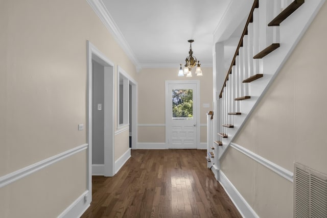 doorway to outside with crown molding, a chandelier, and dark hardwood / wood-style flooring