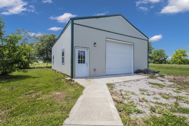 garage featuring a lawn