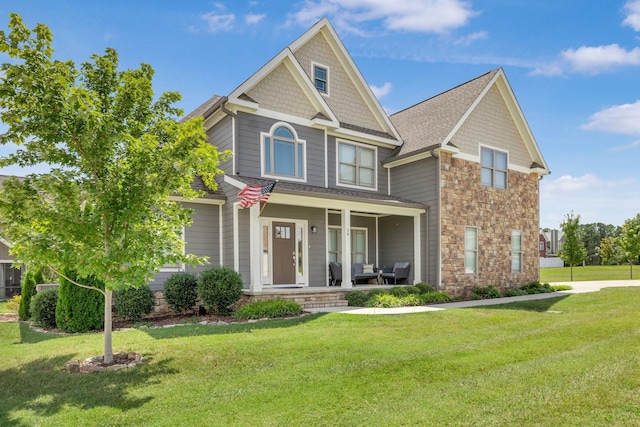 craftsman-style home with a porch and a front yard