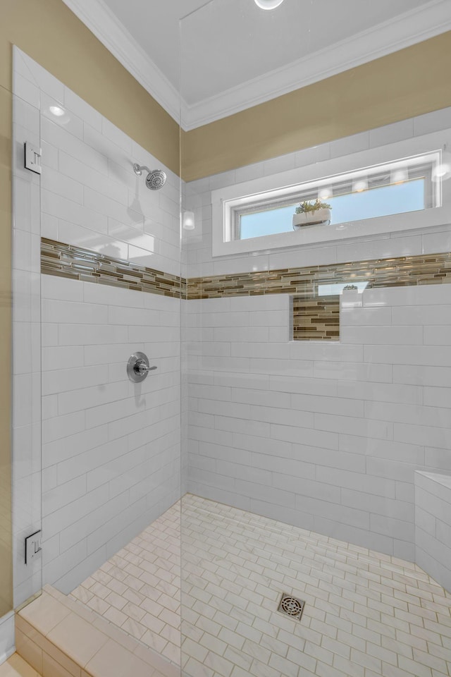 bathroom with ornamental molding and walk in shower