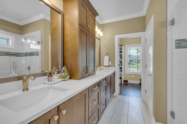 bathroom with a shower with door, crown molding, tile patterned flooring, and vanity